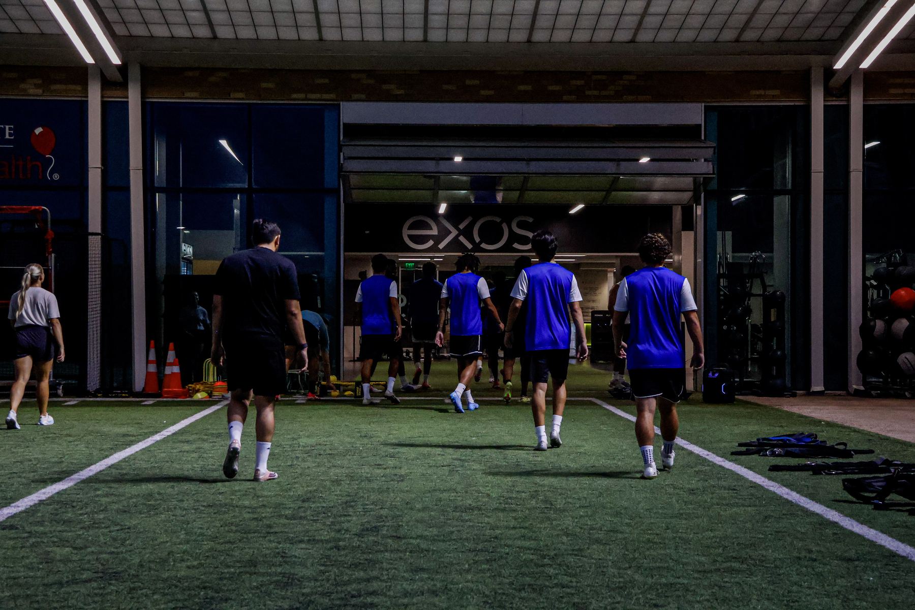 FPA players running a conditioning block on the indoor turf at EXOS in Plano, Texas.